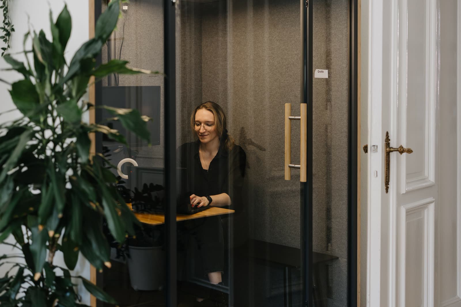 A Gemmpion taking a client call in one of our phone boxes